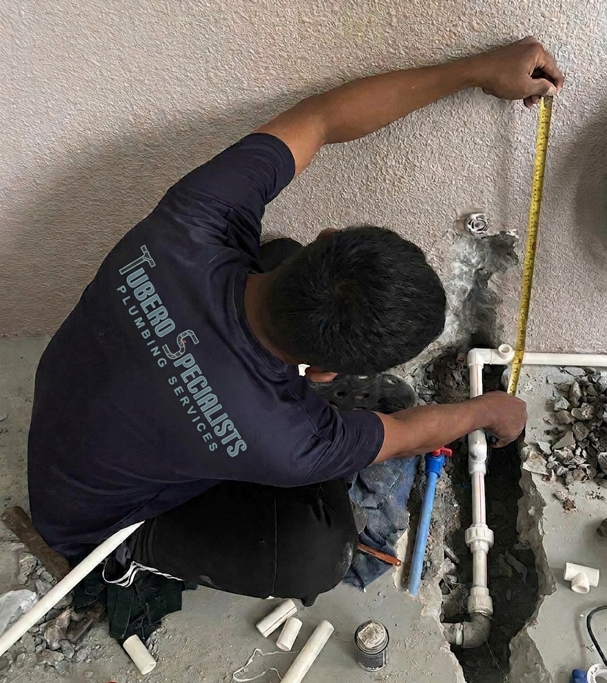 Tubero Specialists plumbing technician performing professional plumbing work at a customer property